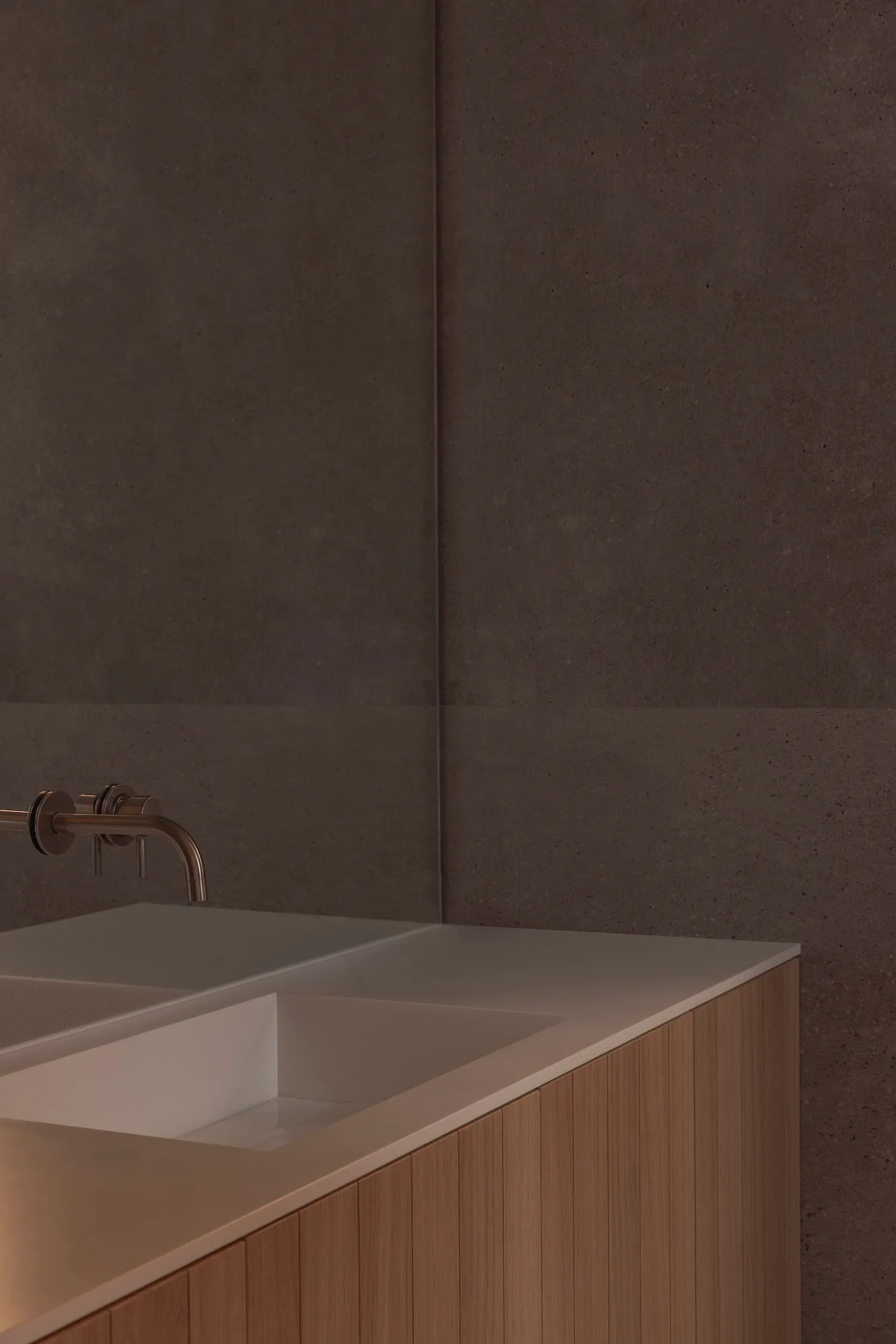 A minimalist bathroom with a modern concrete design