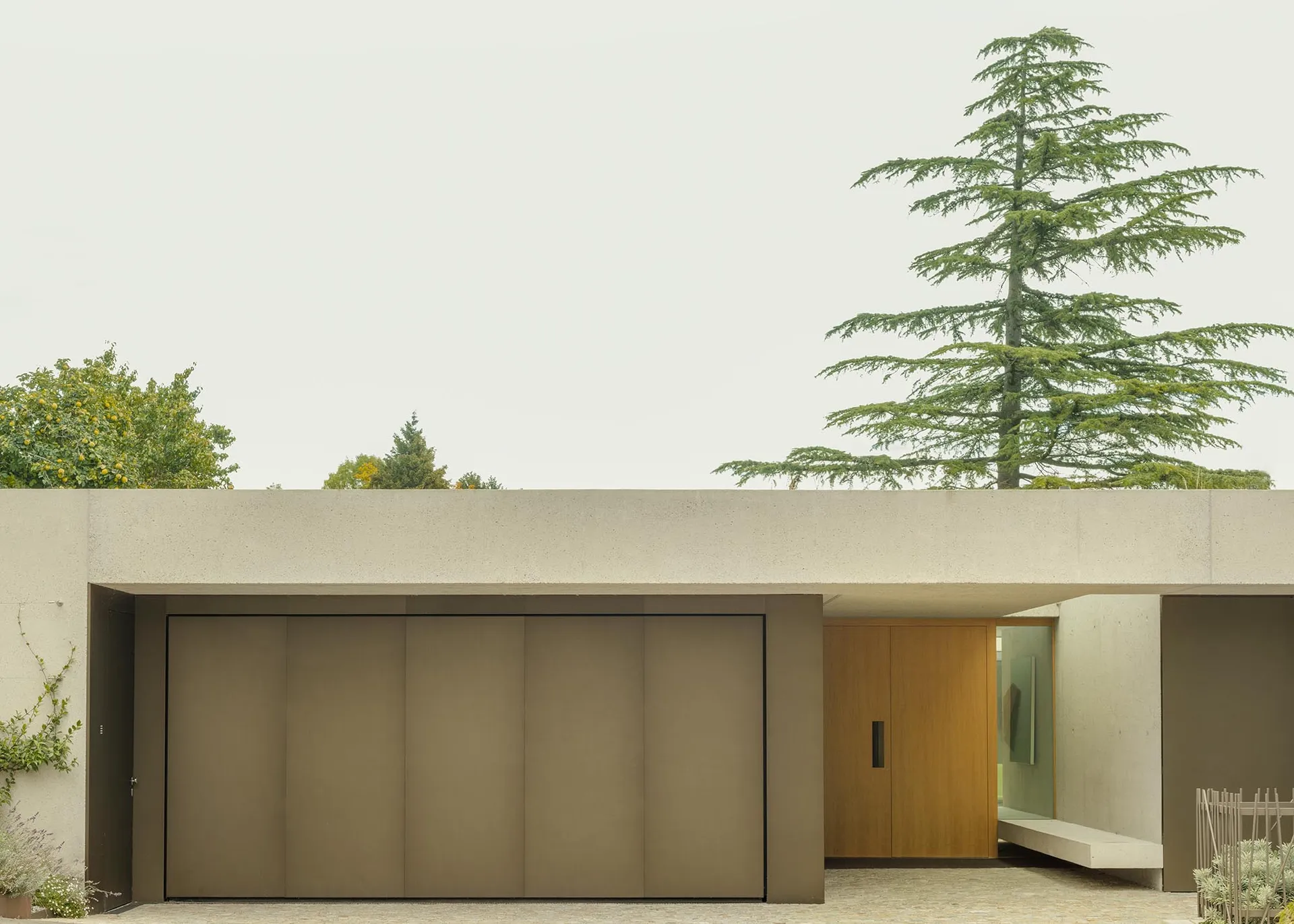 Modern residential home with concrete facade and minimalist design.
