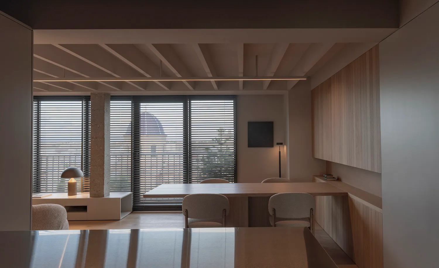 Contemporary office space featuring concrete and wood materials.