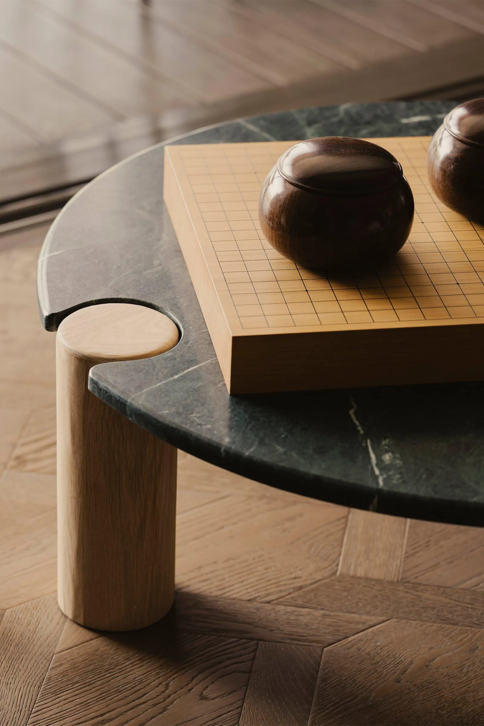 A modern marble table with a board game setup, featuring wooden pieces.