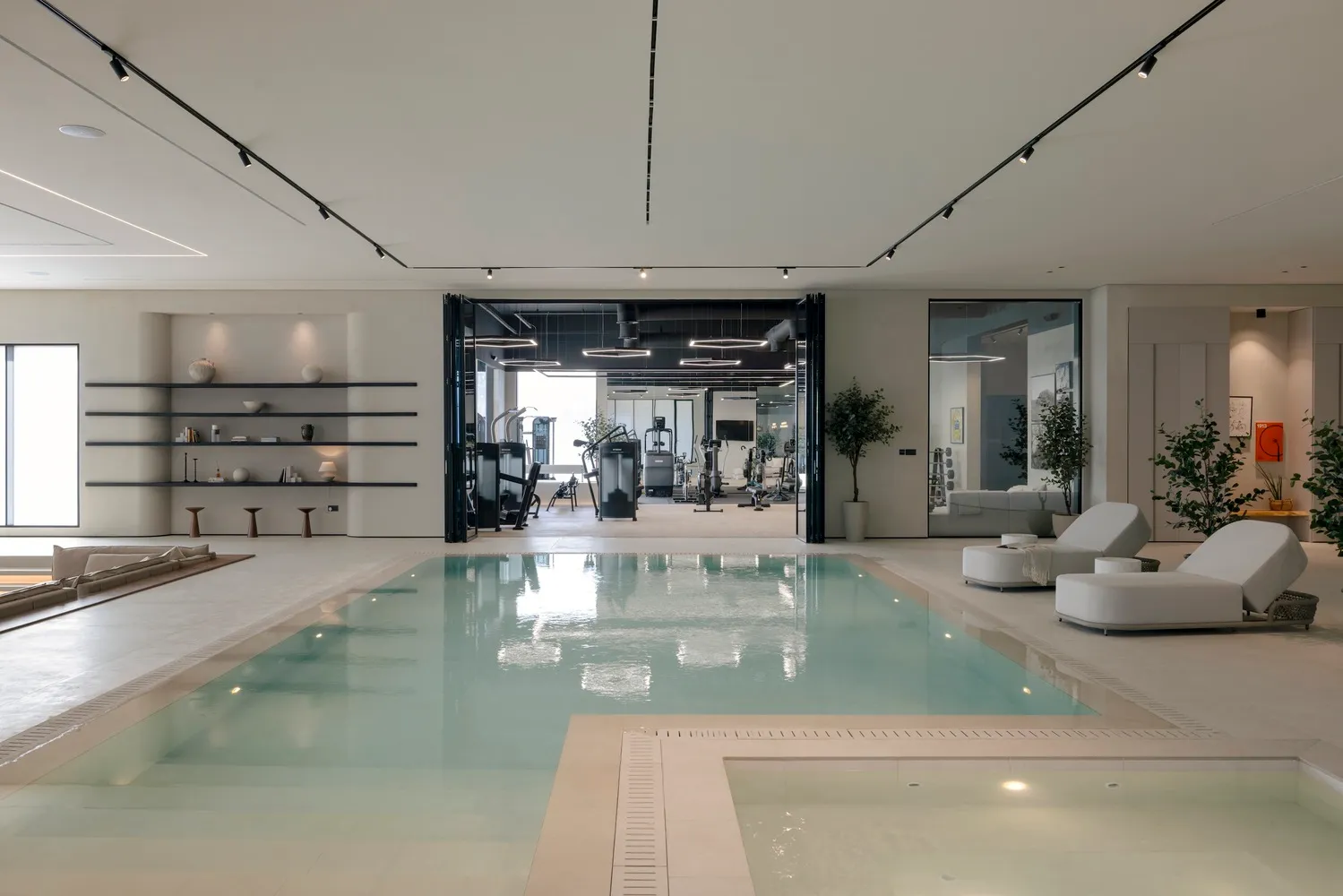 Modern, minimalist gym and swimming pool concept with sleek, clean lines and a neutral color palette.
