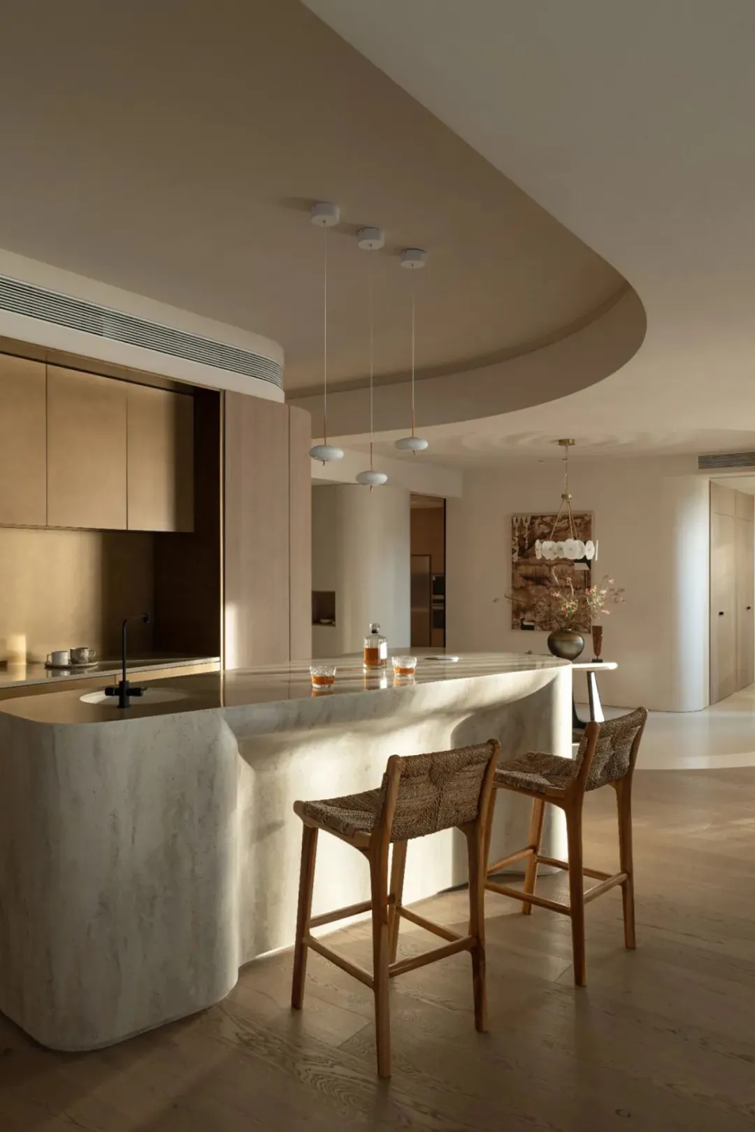 A modern living space featuring concrete, wood, and marble materials.