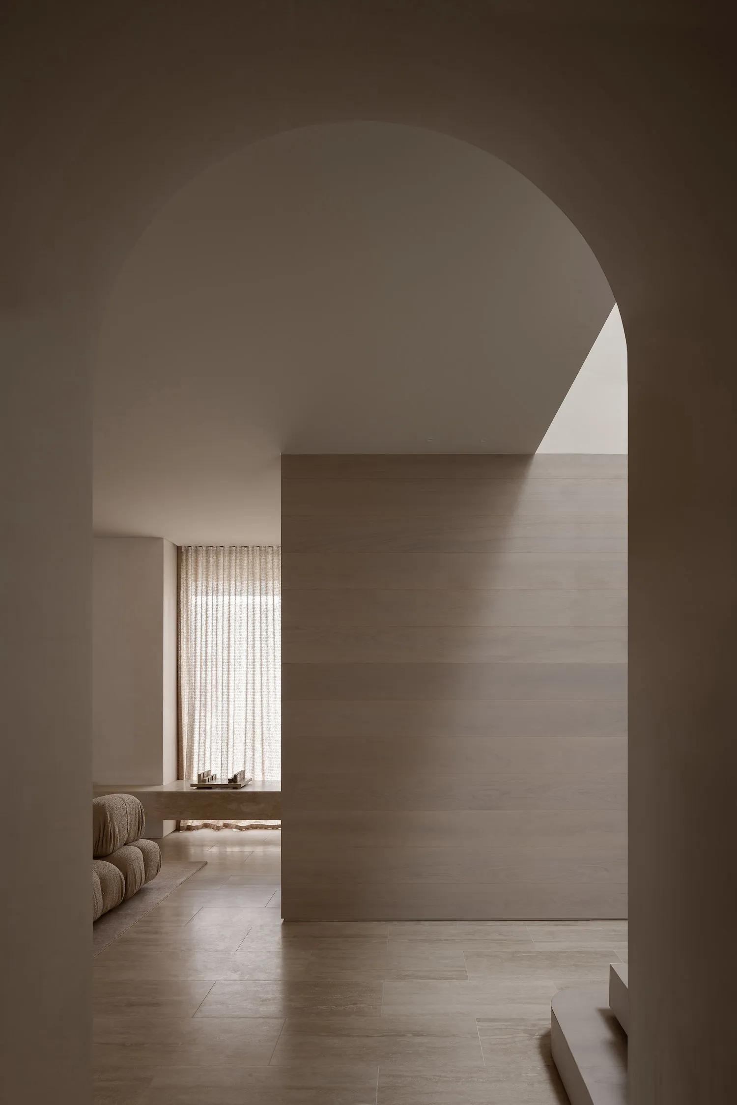 A minimalist residential interior with wood elements.