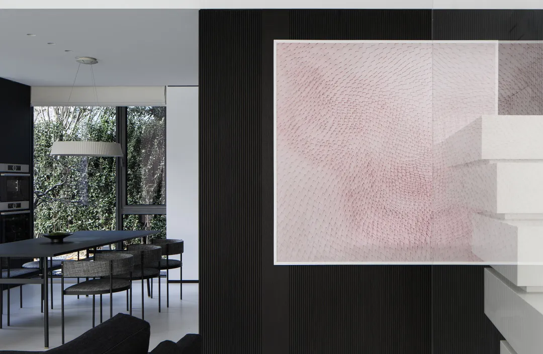 Modern minimalist interior with black metal accents.