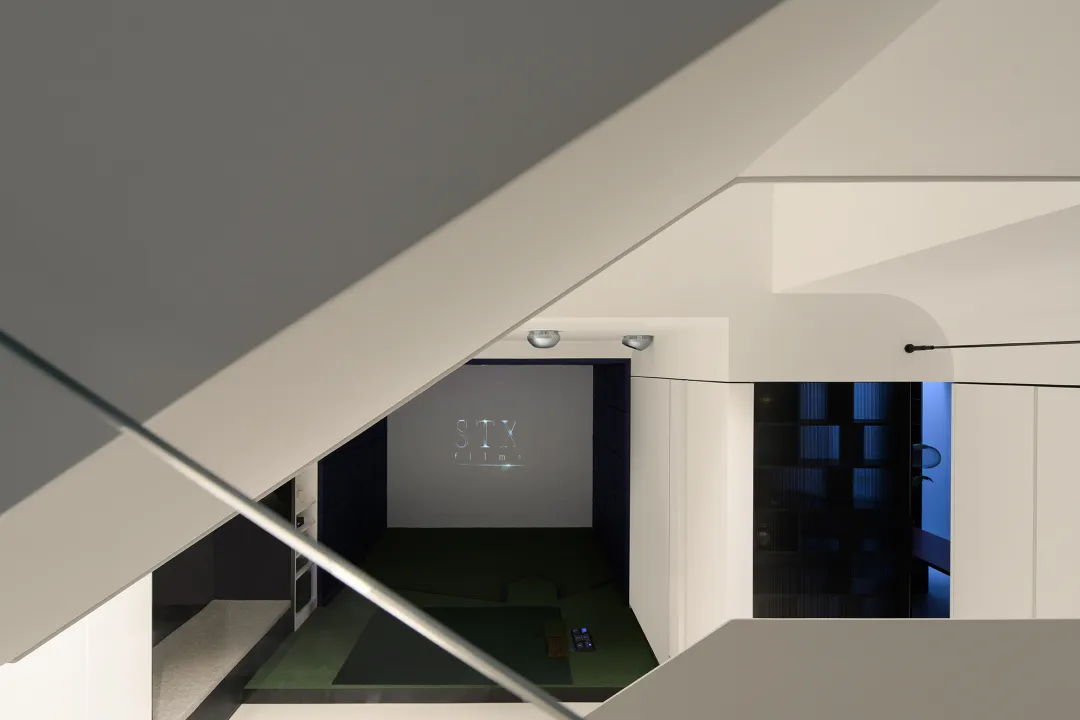 A modern office space featuring a glass window with minimalist design elements.
