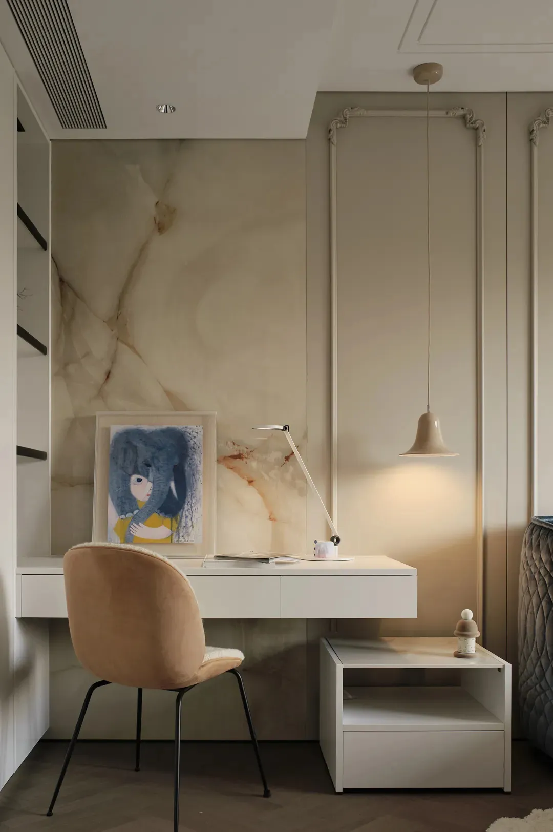 A minimalist bedroom with a modern desk featuring a marble surface.