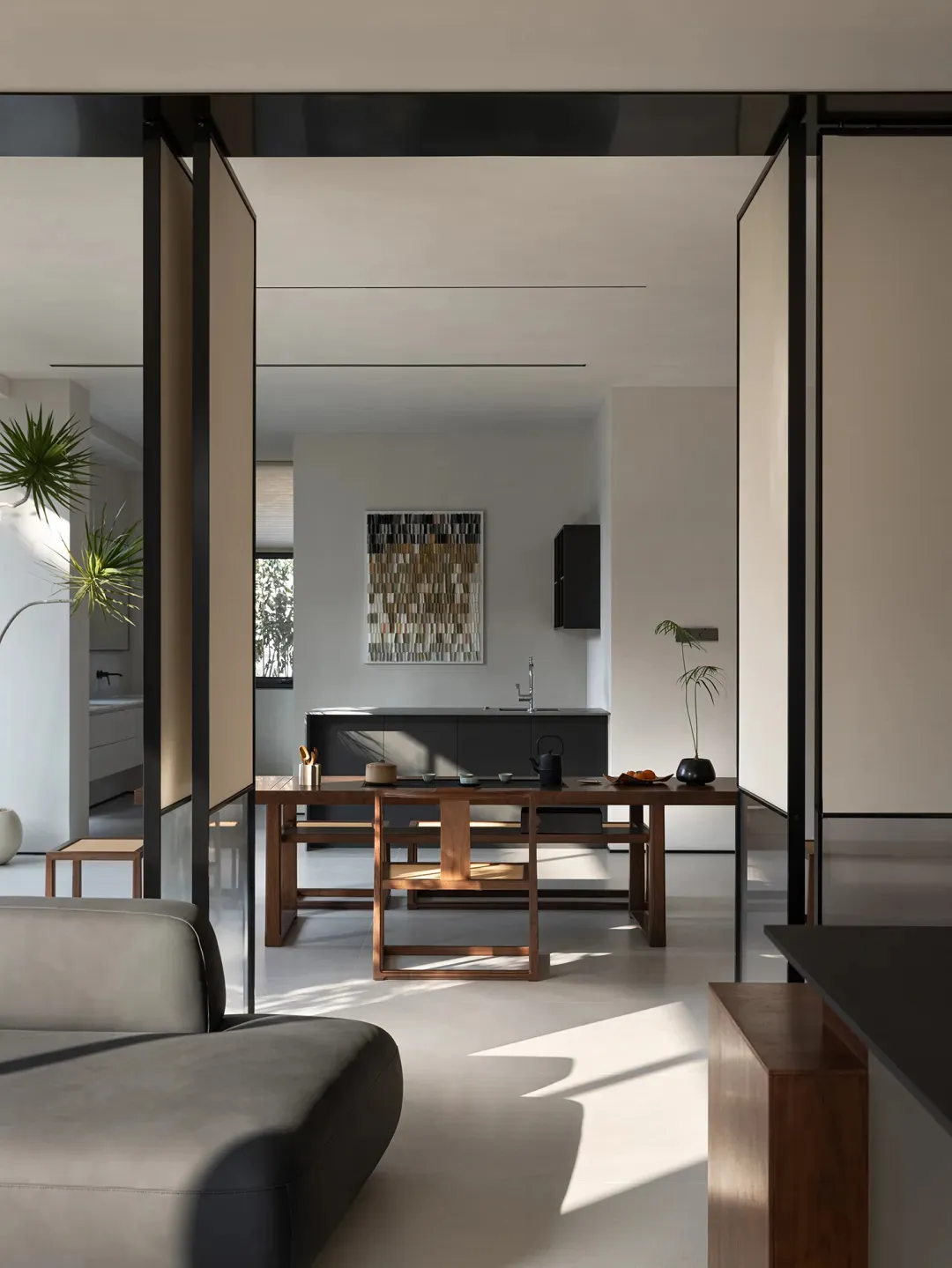 Modern living room with wooden furniture and metallic accents.