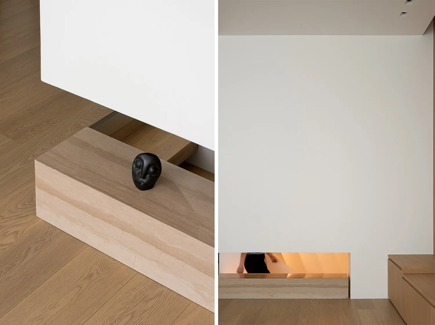 Minimalist staircase with a light fixture integrated into the wall, showcasing clean lines and modern design.