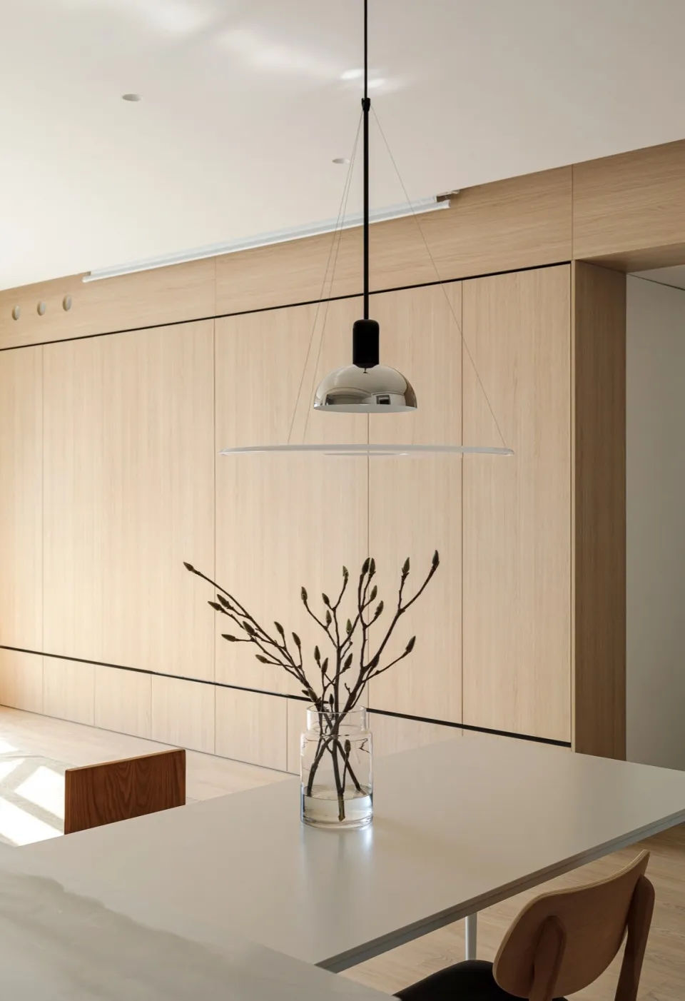 A minimalist interior design featuring wooden materials and sleek lines.
