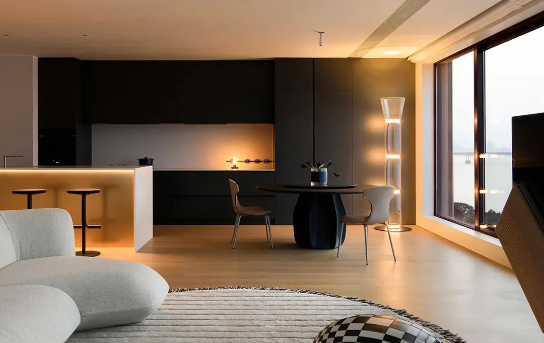 Spacious living room with a modern kitchen and minimalist design.