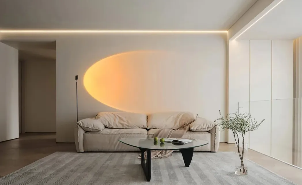 Sofa and coffee table in a modern minimalist living room with neutral tones.