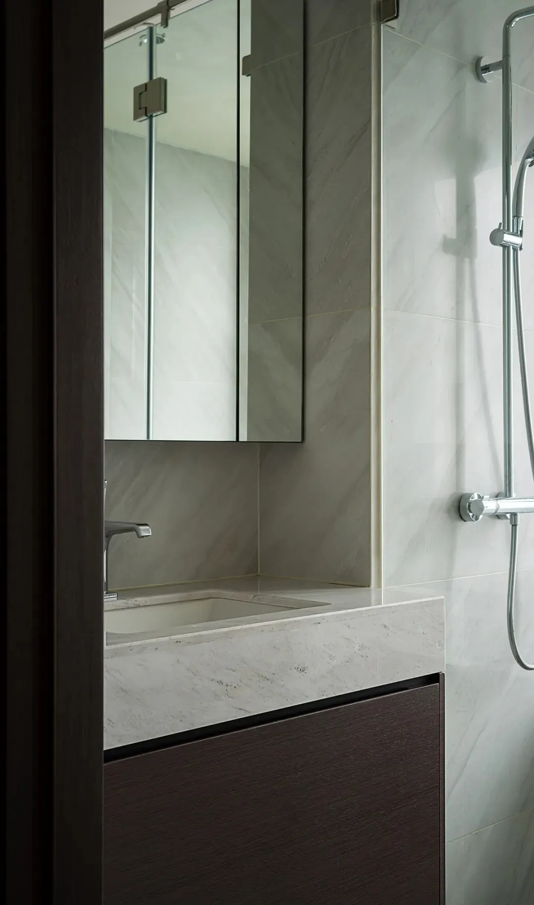 Minimalist bathroom featuring concrete materials and a modern design aesthetic.