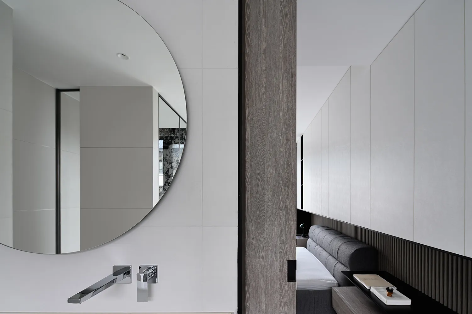 Modern minimalist bedroom with wood, concrete, and metal finishes.