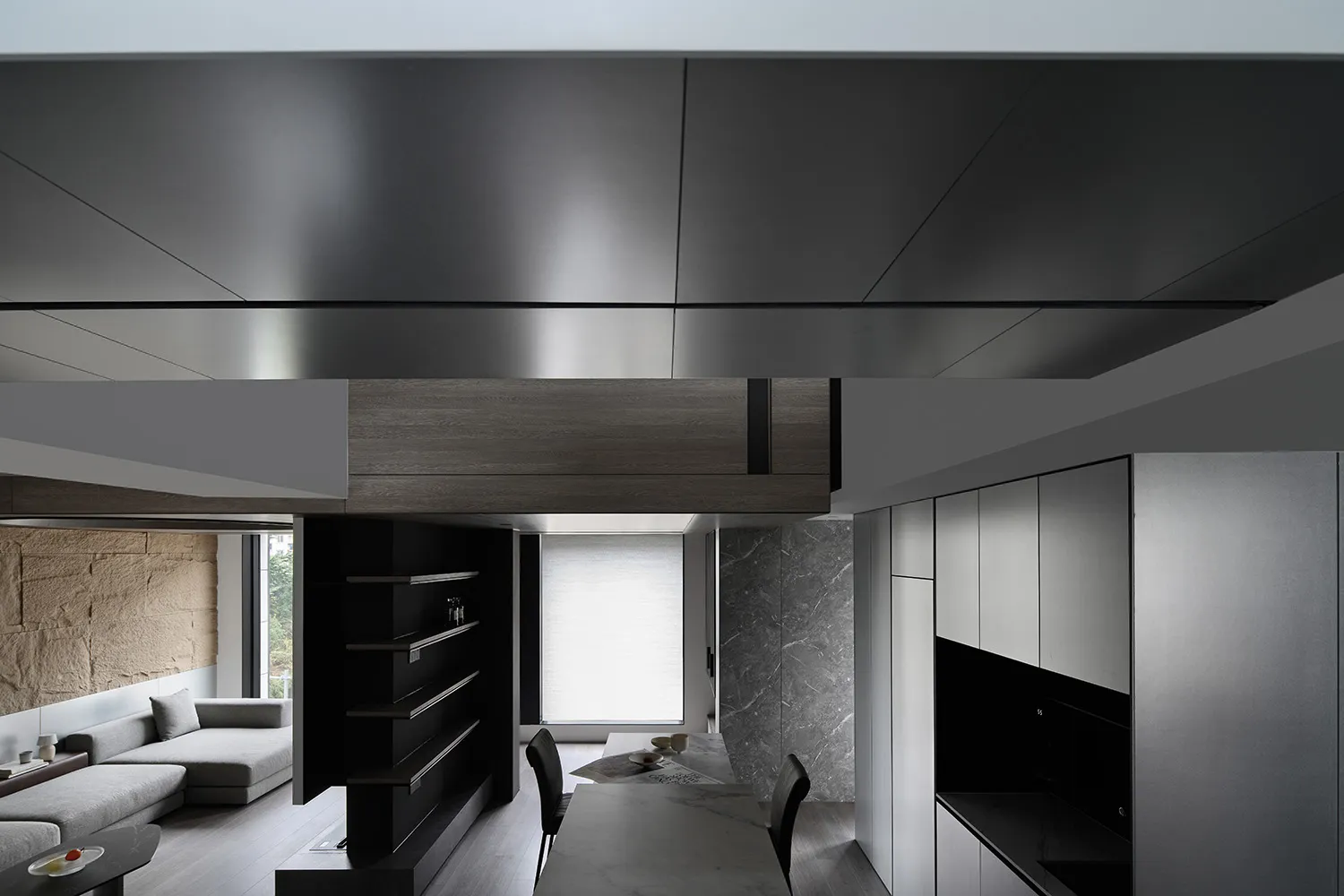 Modern interior design featuring an open-plan living room and kitchen with wood, marble, and concrete materials.