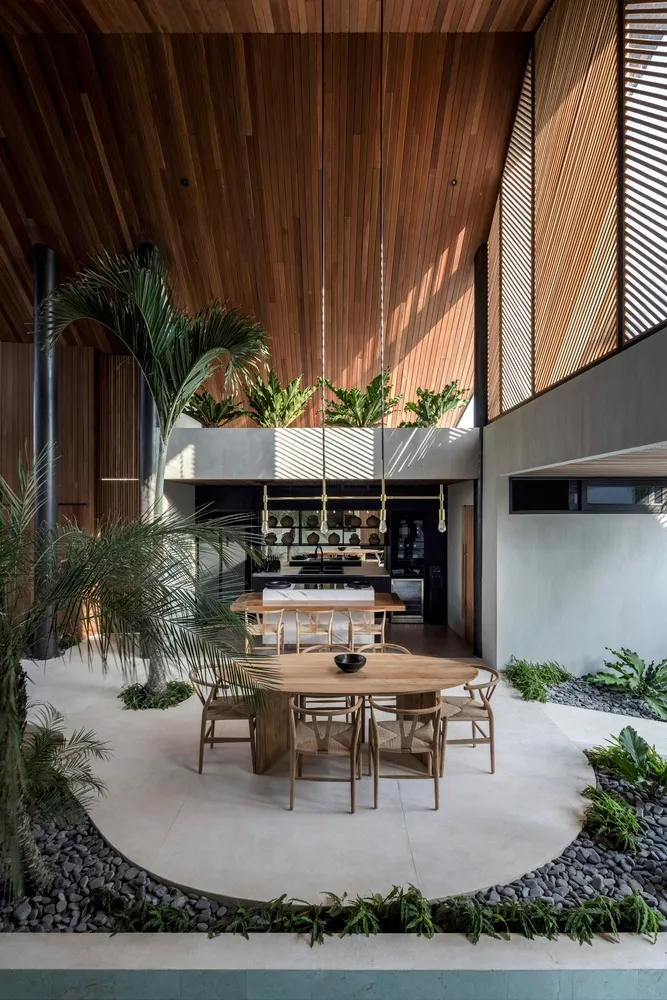 Modern residential interior featuring a combination of wood, concrete, and stone materials.