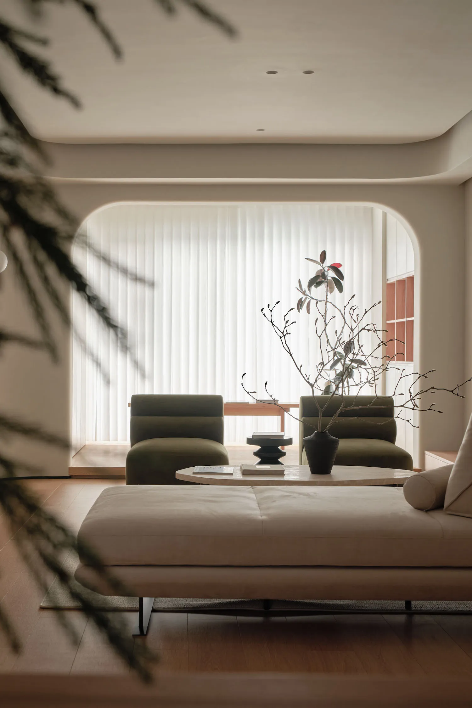 A modern minimalist living room with neutral colors and contemporary furniture.