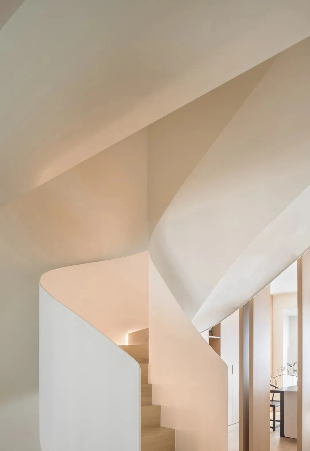 Modern minimalist staircase made of concrete, featuring clean lines and an elegant design.