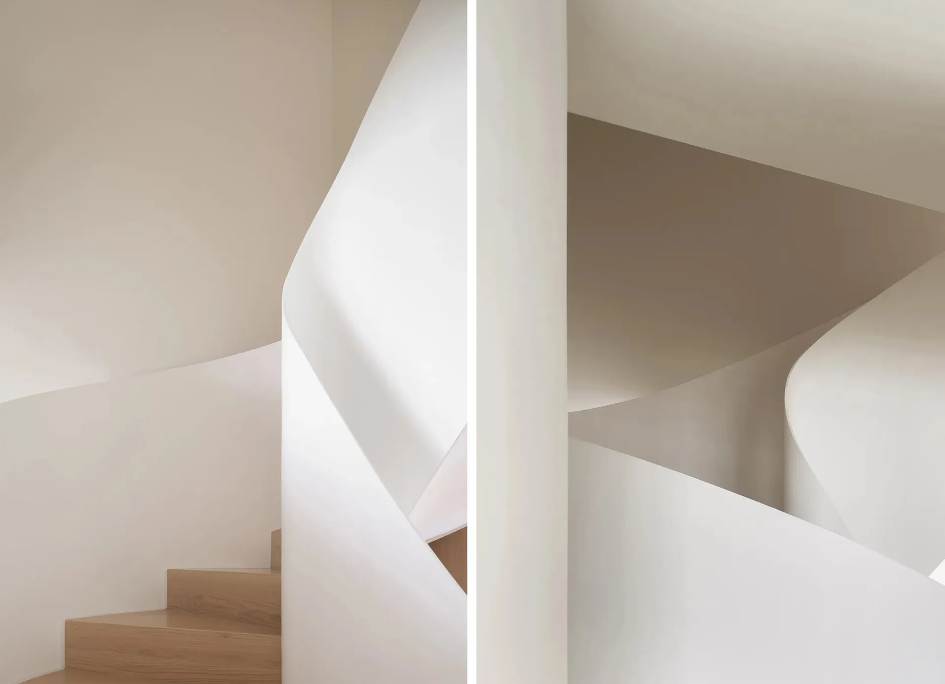 Modern, neutral-toned spiral staircase with smooth, curved walls.