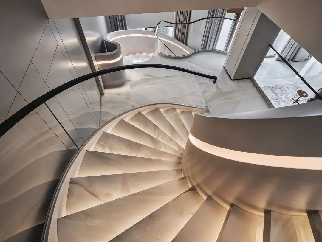 Modern interior staircase with marble steps and lighting