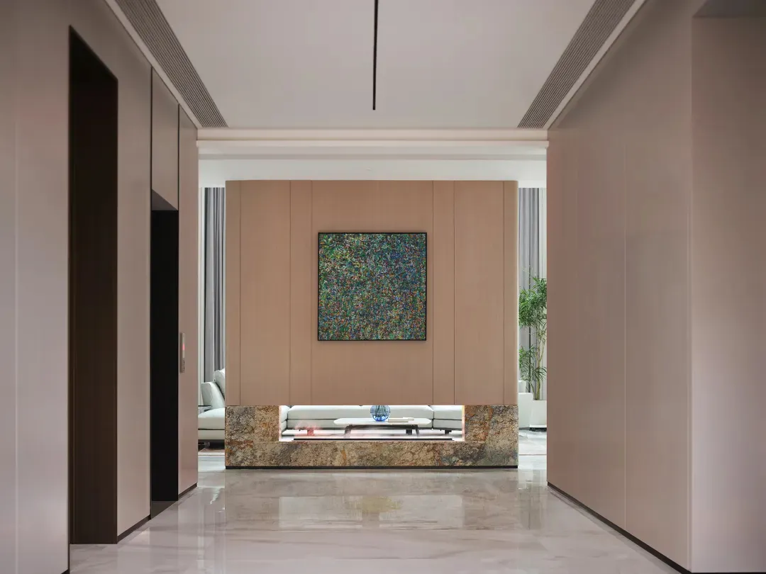 Modern living room featuring wooden paneling and marble flooring