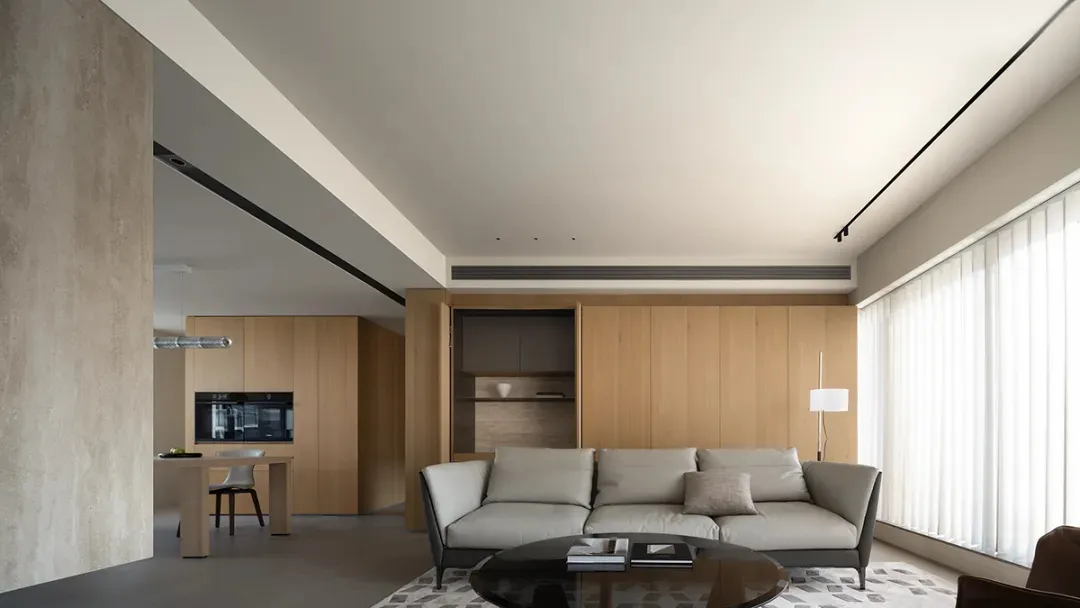 Modern living room featuring wooden panels and a minimalist design