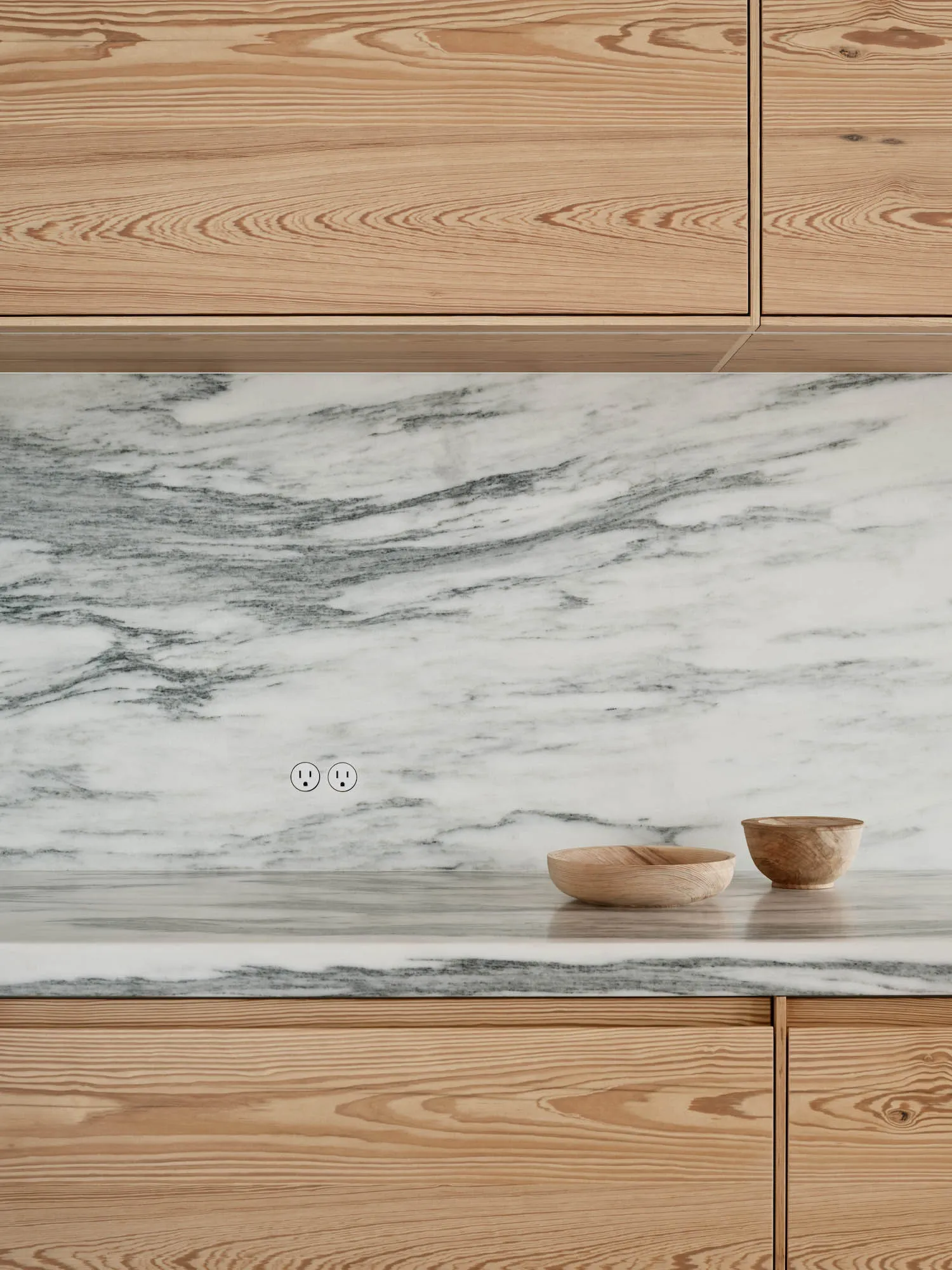 Modern kitchen with wooden cabinets and marble countertop