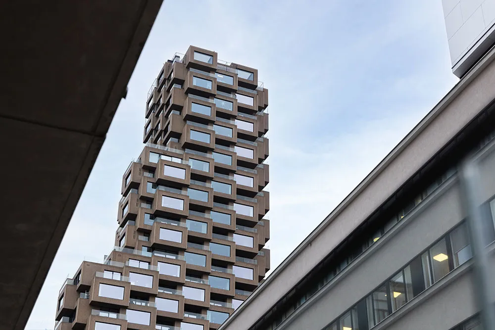 Modern high-rise building with a combination of concrete and glass materials.
