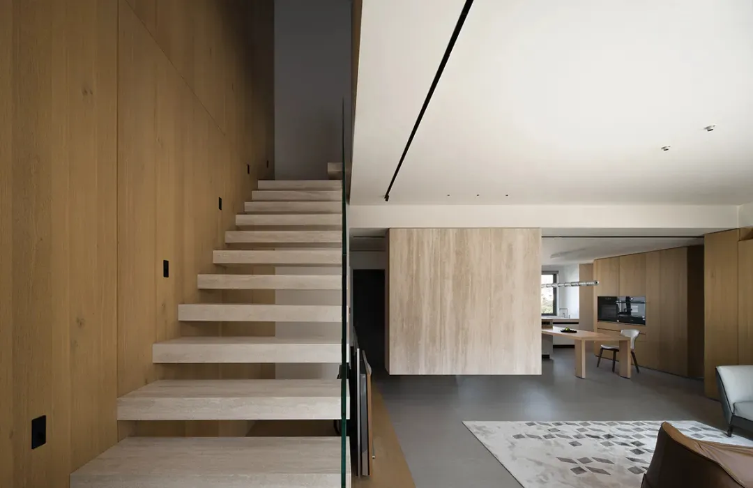 Modern interior space with glass and wood elements.