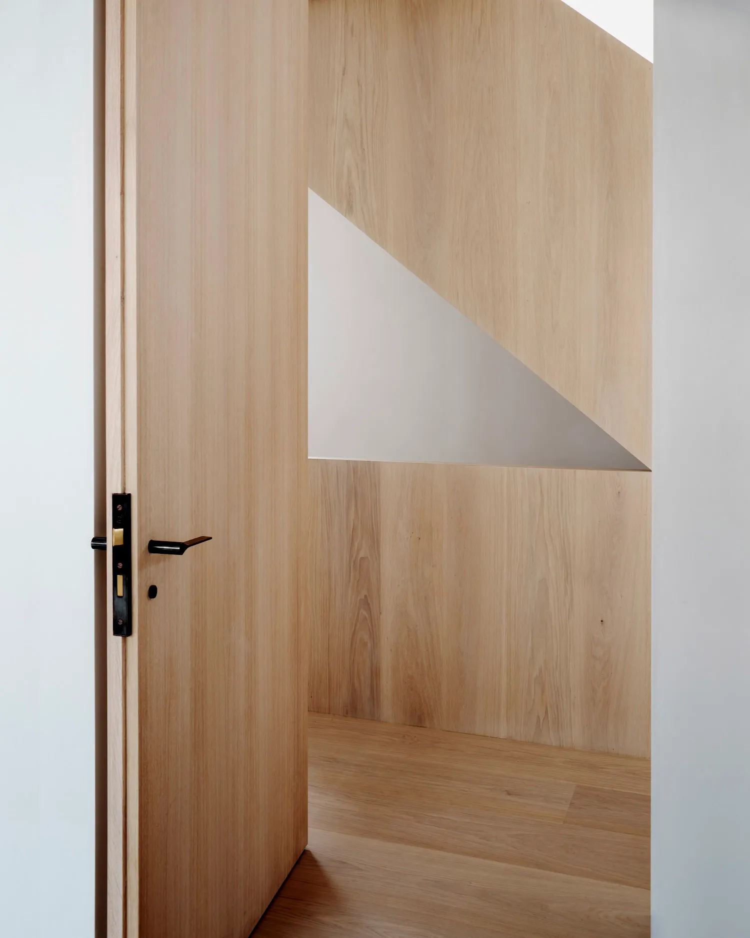 Modern minimalist interior design with a paneled wooden wall