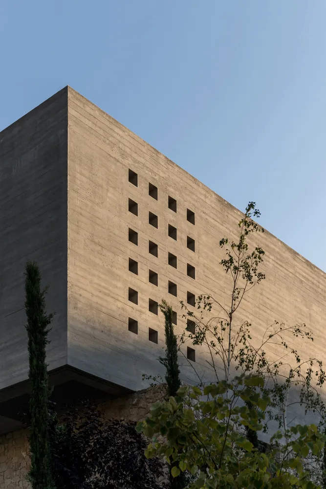 Concrete building facade with a pattern of rectangular openings