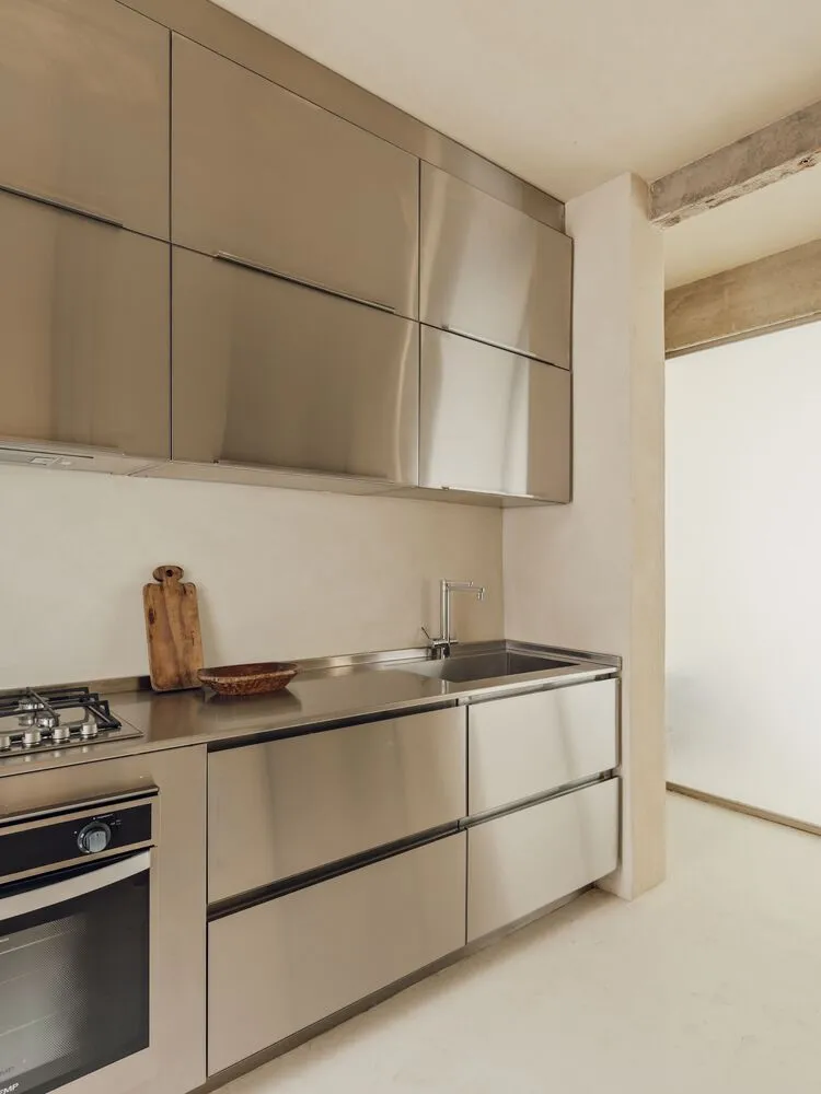 Modern kitchen featuring metallic materials and minimalist design