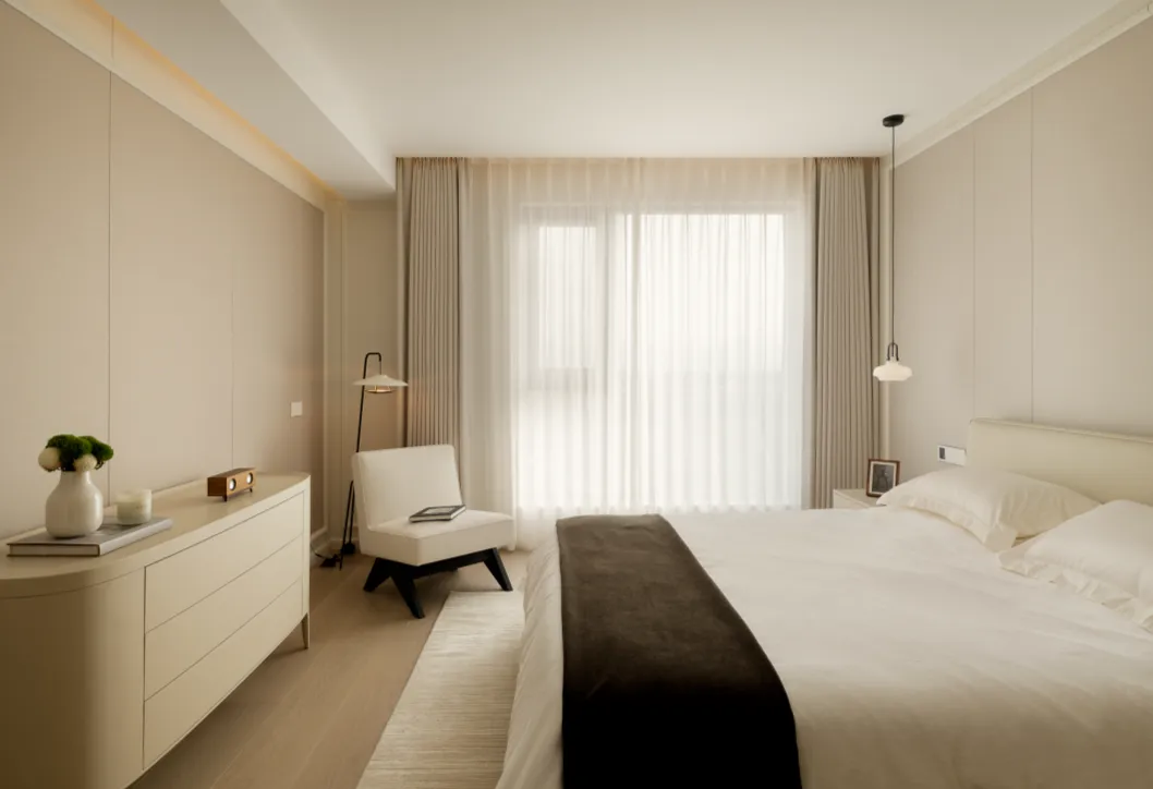 Spacious minimalist bedroom with modern furniture and glass window