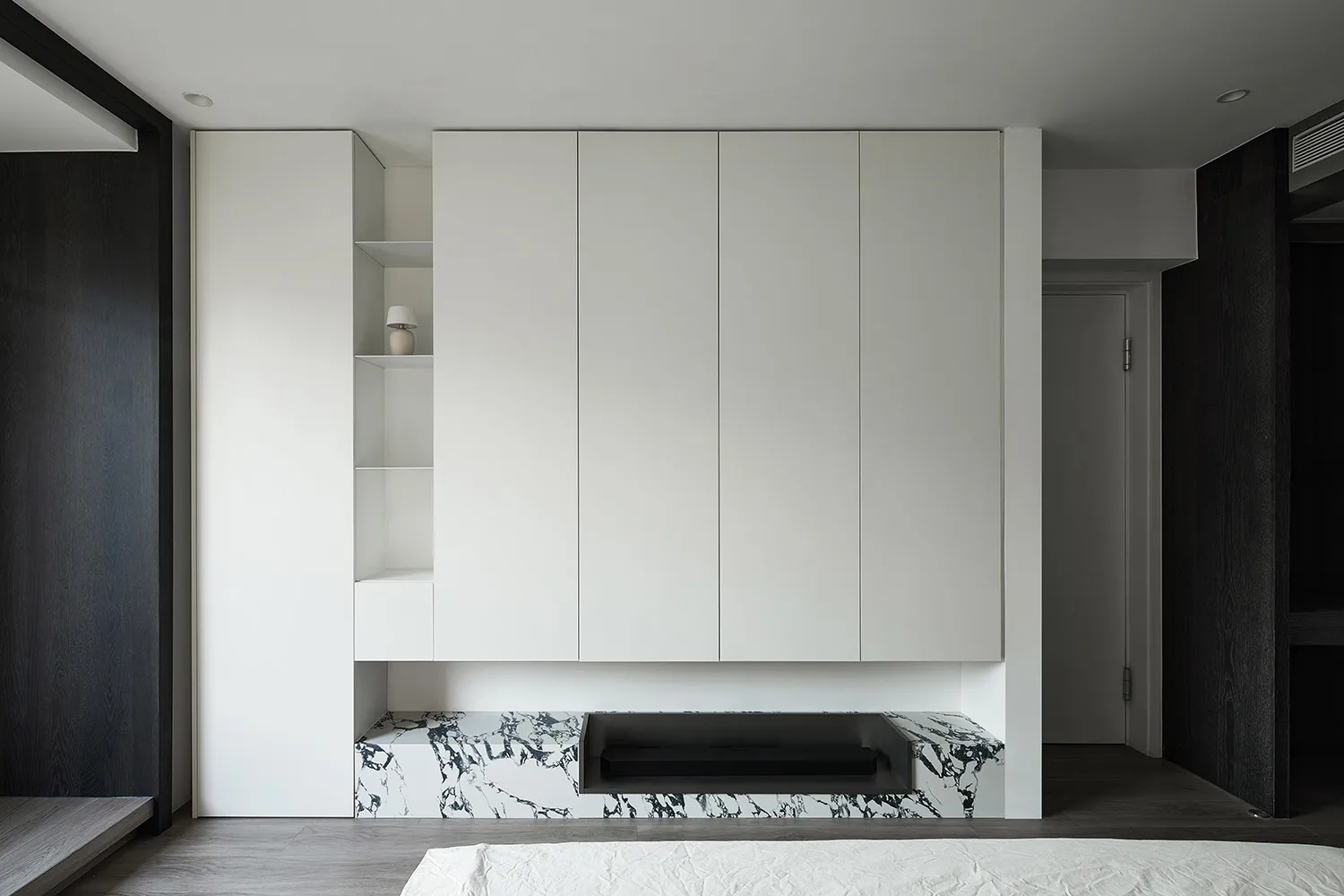 Modern bedroom featuring a marble storage unit