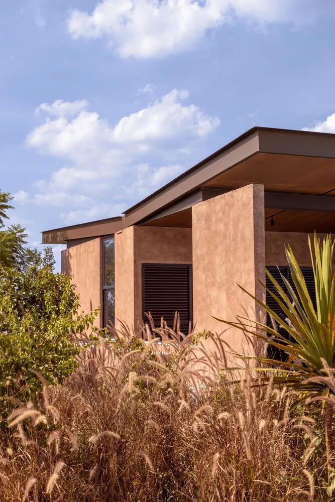 A modern building with a concrete exterior featuring a unique architectural design.