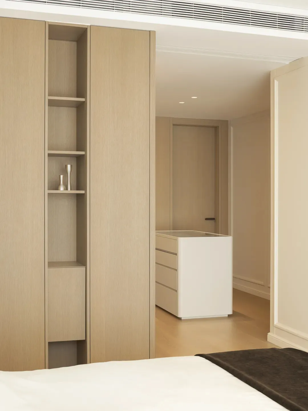 Modern residential bedroom featuring wooden furniture