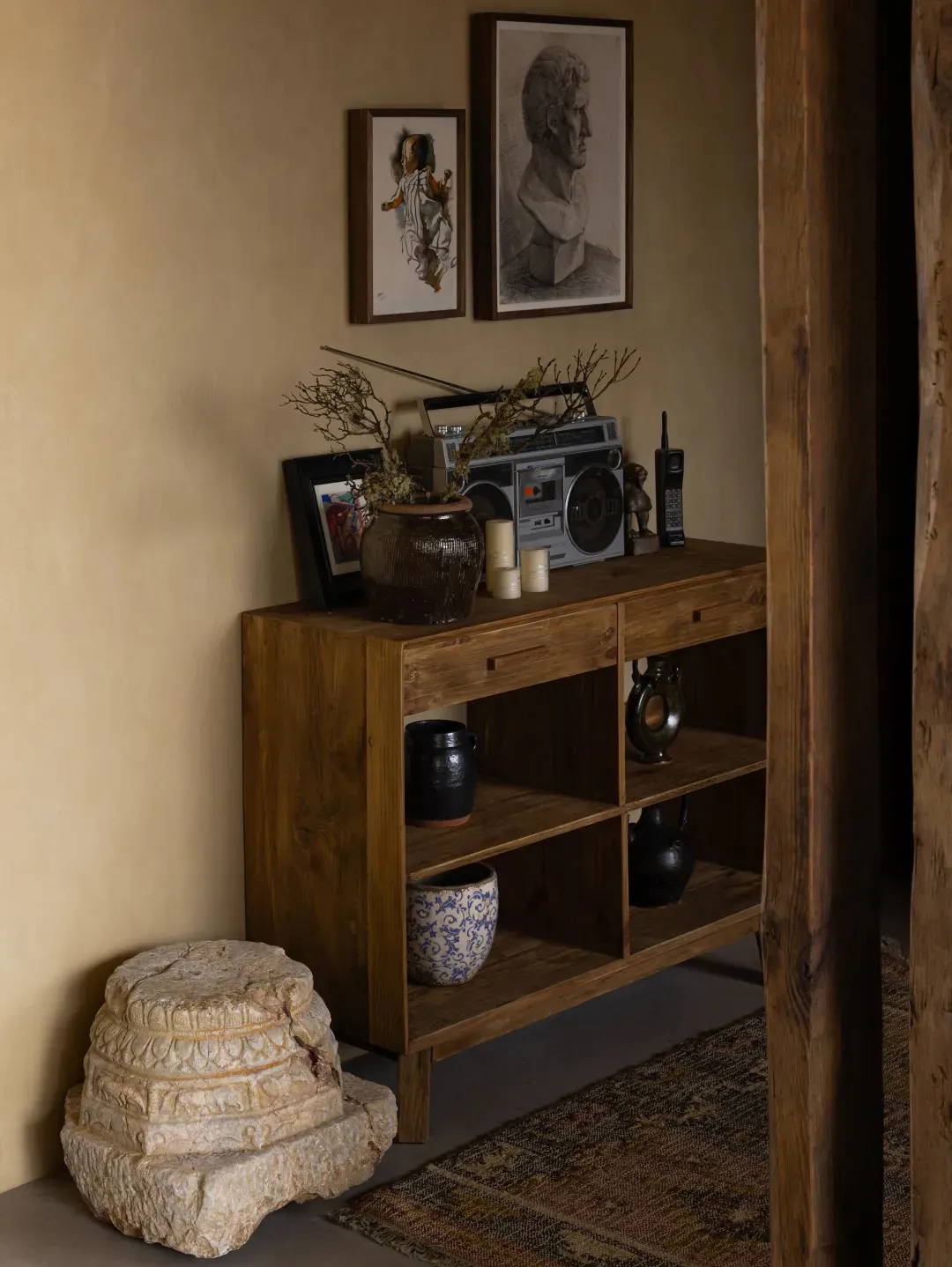 A wooden shelf with various industrial-style accessories and items.