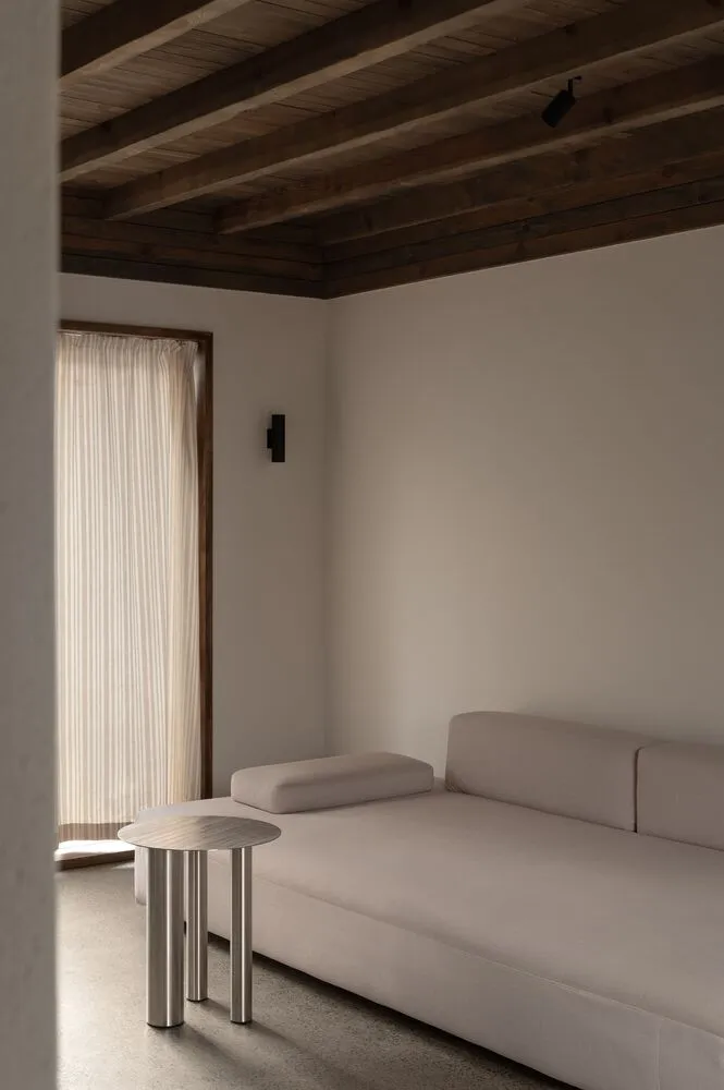 Minimalist, neutral-tones sofa in an office setting