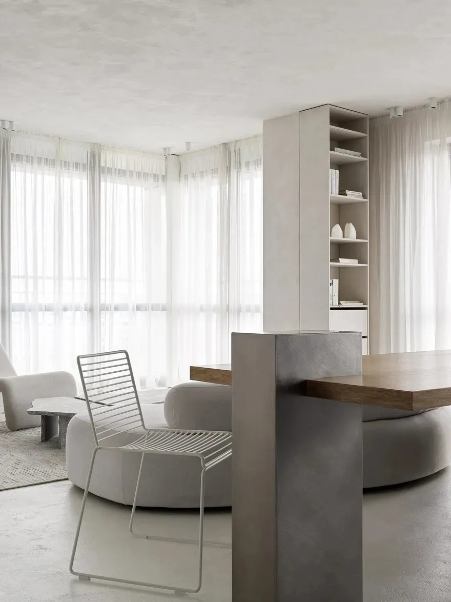 Contemporary living room featuring modern minimalist design, wooden furniture, metal accents, and fabric seating.