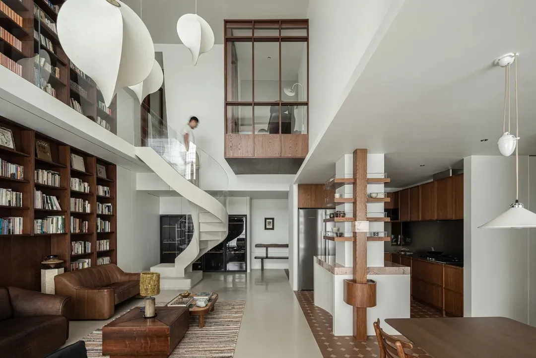A modern residential interior featuring a white concrete staircase, wooden accents, and a glass wall.