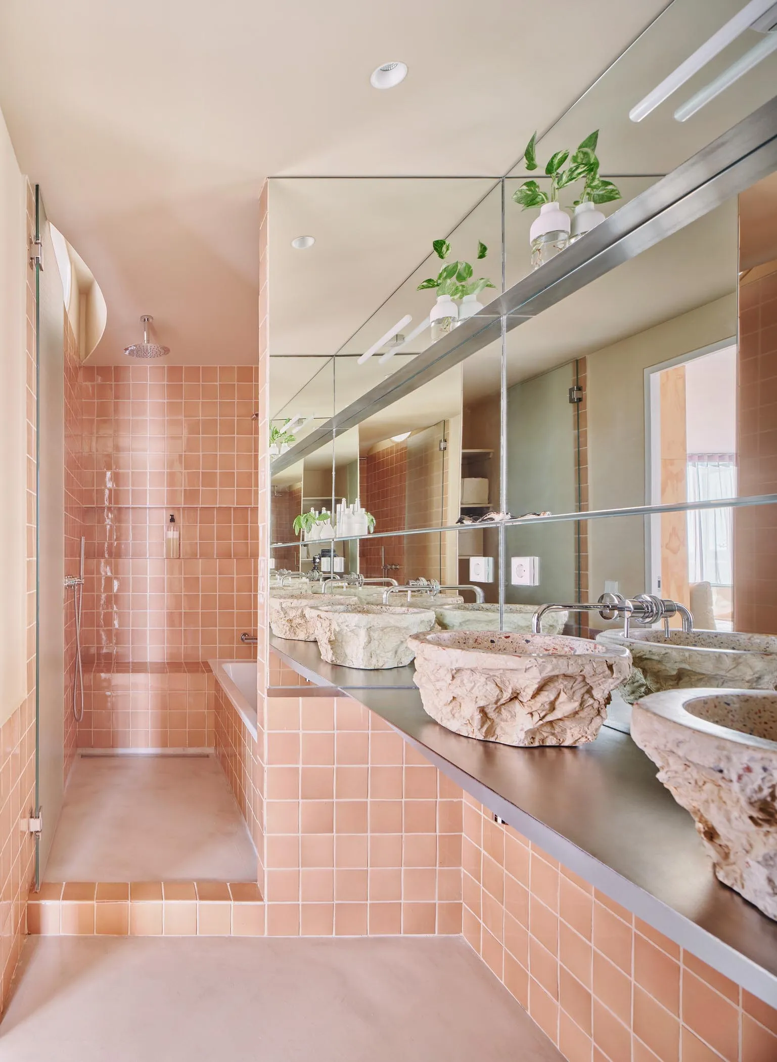 A minimalist bathroom with modern concrete finishes, flat surfaces, and geometric patterns.
