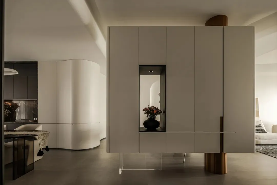 Modern minimalist living room featuring metallic accents and sleek design elements.