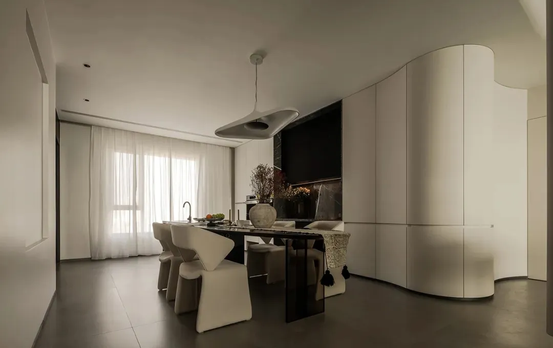A modern, all-white kitchen featuring sleek lines and contemporary design elements.