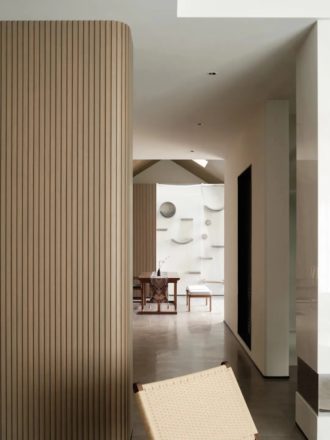Modern interior design featuring flat, paneled walls made of wood.