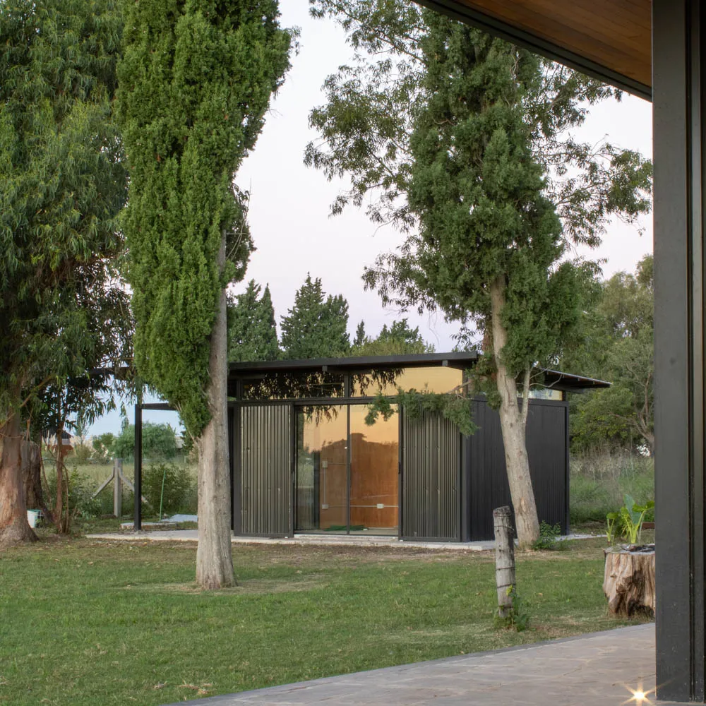 Modern house exterior with metal siding and large glass windows