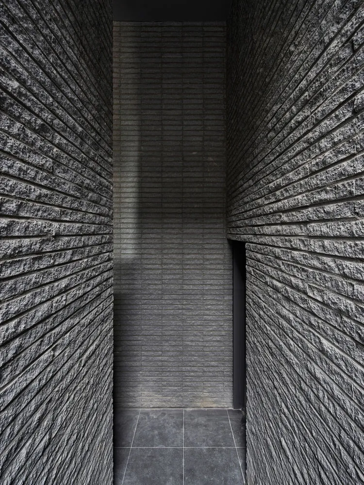 A modern interior space featuring a brick wall.