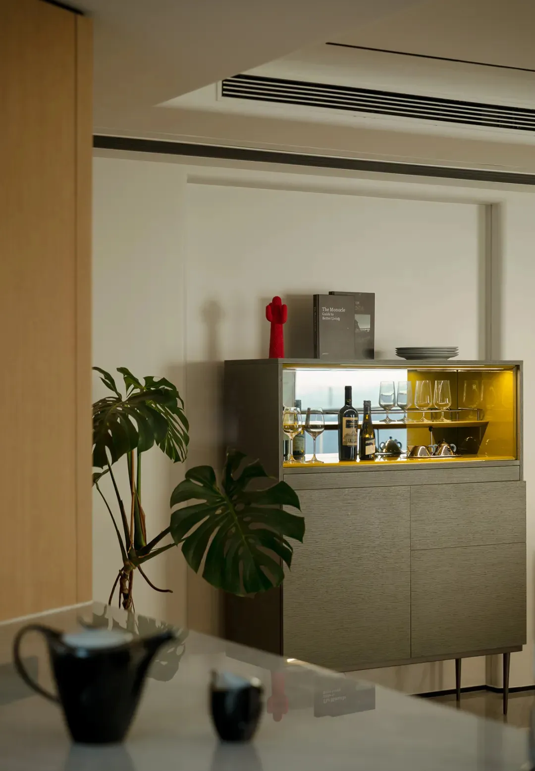 Modern living room featuring modular furniture and a plant.