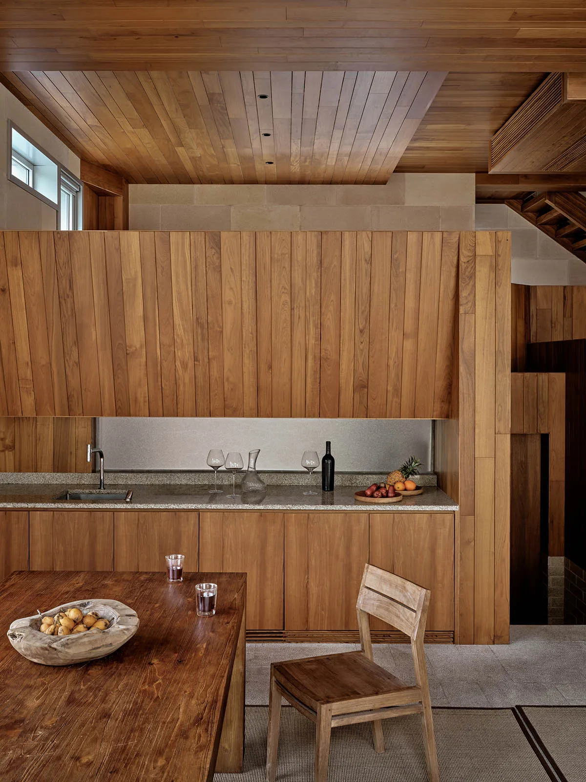 Modern kitchen featuring wooden cabinets and countertops, with a focus on the clean lines and natural wood textures.