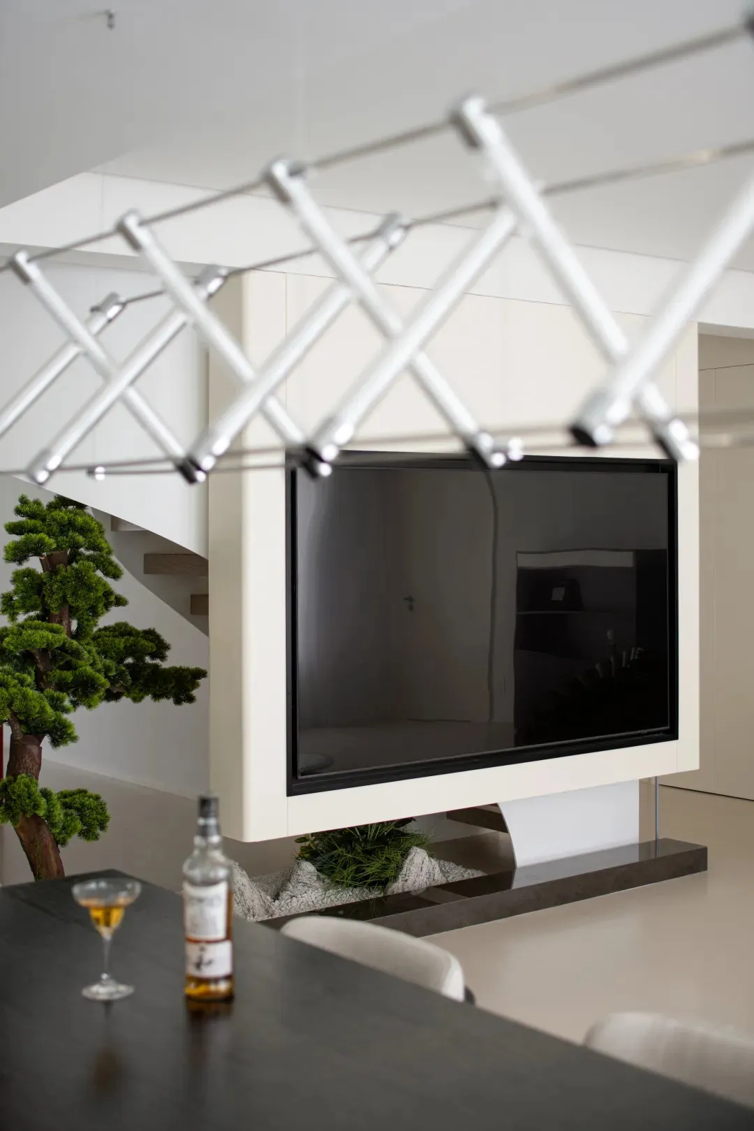 Modern living room featuring a concrete fireplace and minimalist design.