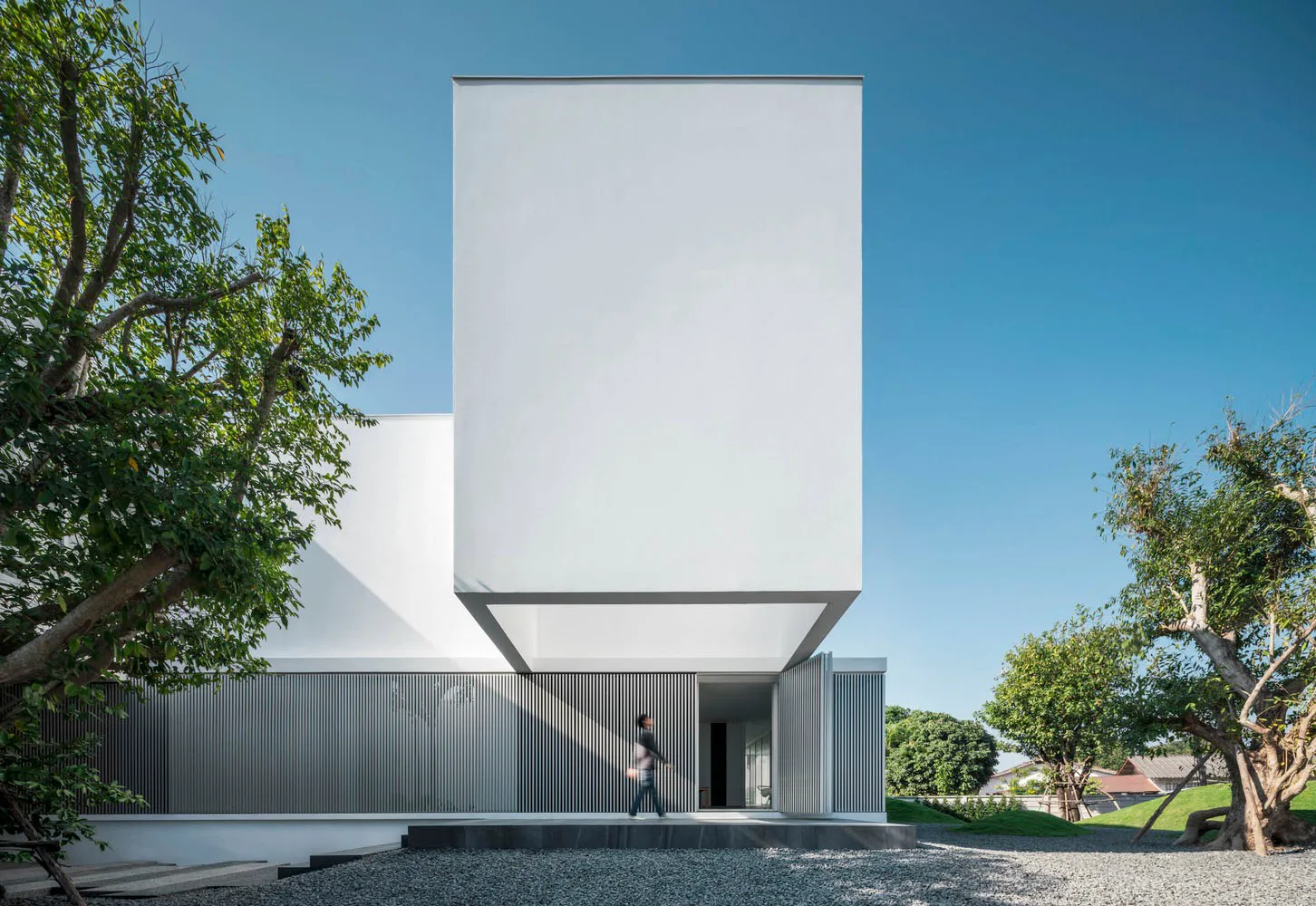 A modern building with a concrete exterior and minimalist design.