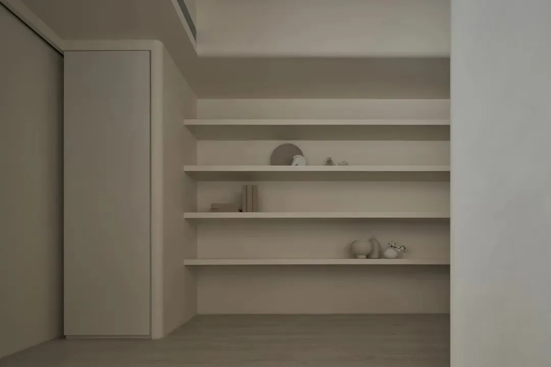Minimalist interior design featuring modern wooden floating shelves